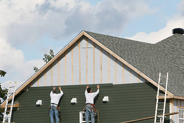 Professional Storm Damage Siding Repair technician working in Quincy, IL